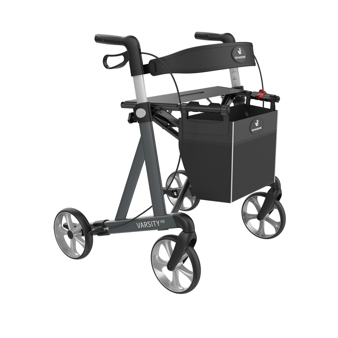 The Rehasense Varsity HD XL Bariatric Lightweight Rollator features a black and gray aluminum frame, four wheels, built-in seat, storage basket, hand brakes, and the brand name printed on the frame.